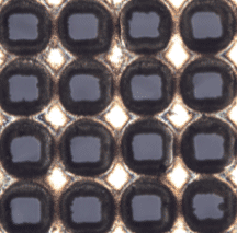 These square features were micro-drilled with a CANUNDA-PULSE reflective laser beam shaper with an Amplitude Ultrafast Laser, and their shape minimizes side overlap and material waste. Image courtesy of Cailabs